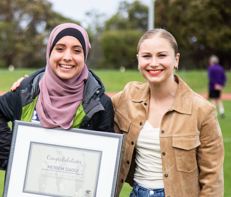 RECOGNITION: Meriem Daoui receives her award with Australian of the Year Grace Tame.