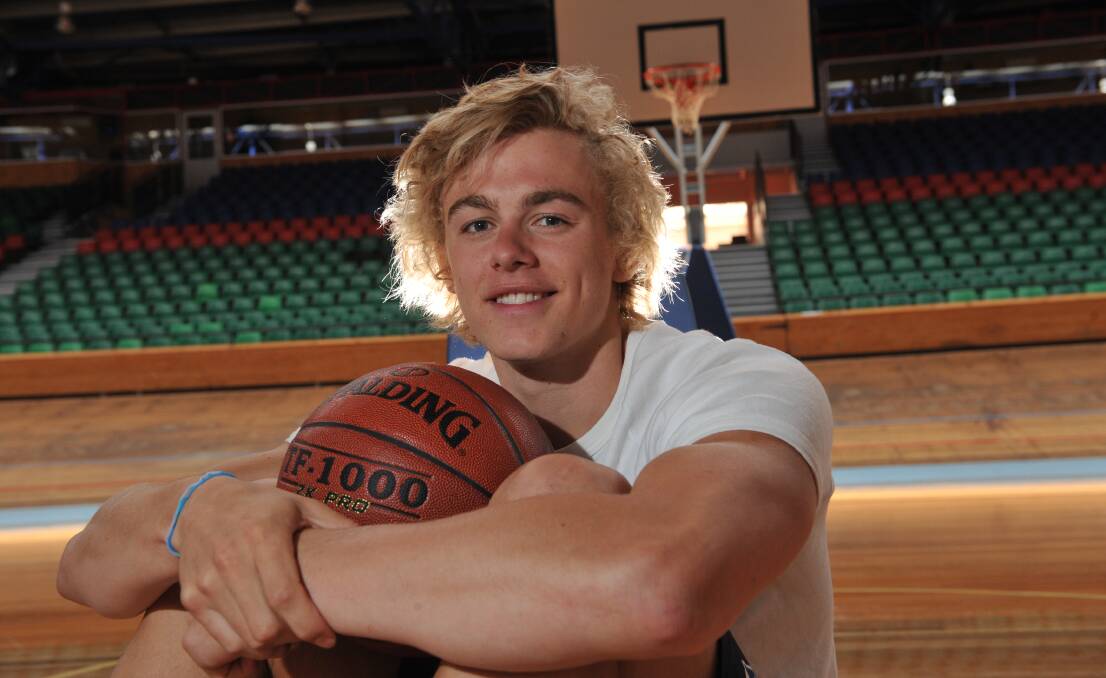Treading the boards: Hugh Greenwood at a basketball camp at the Silverdome in 2011.