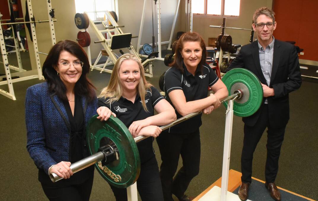 Raising the bar: Minister for Sport Jacquie Petrusma with coaches Wenonah Sharman and Janelle Smith and acting Tasmanian Institute of Sport director Stewart Pither. Picture: Paul Scambler