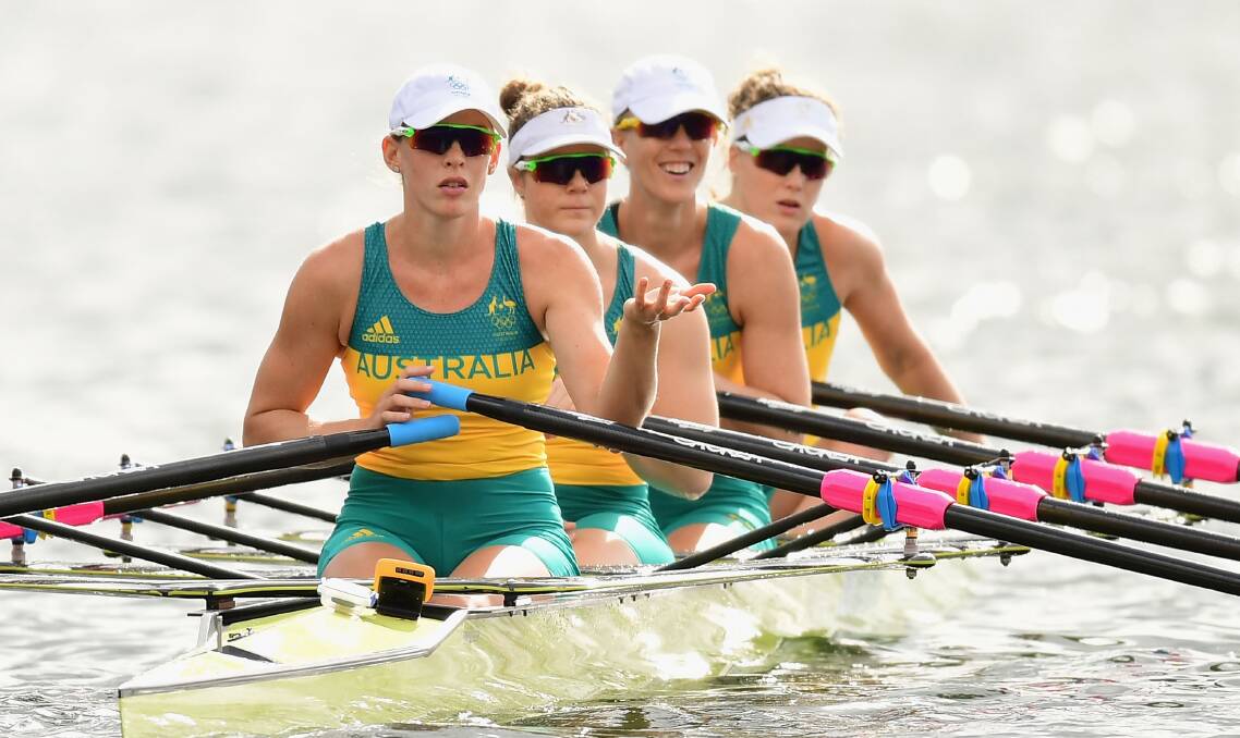 Cheers: Kerry Hore (third from left) finds plenty to smile about while training with quad sculls crewmates Jessica Hall, Jennifer Cleary and Madeleine Edmunds at Lagoa Rodrigo de Freitas in Rio de Janeiro. Picture: Getty Images