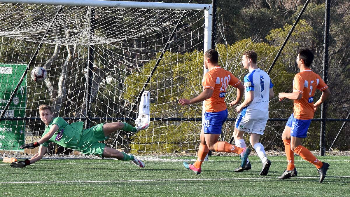 Riverside Olympic goalkeeper Jarrod Hill makes a save against Olympia Warriors. Picture: Walter Pless