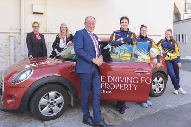 Driving forward: Northern Hawks players with staff from sponsors Knight Frank. Picture: Jess Stevenson