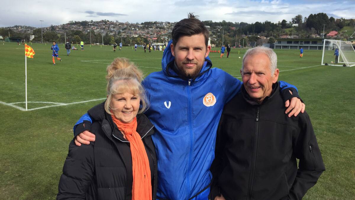 Lap record: Aaron Campbell with parents Sue and Malcolm ahead of his 150th statewide soccer match on Saturday. Picture: Rob Shaw