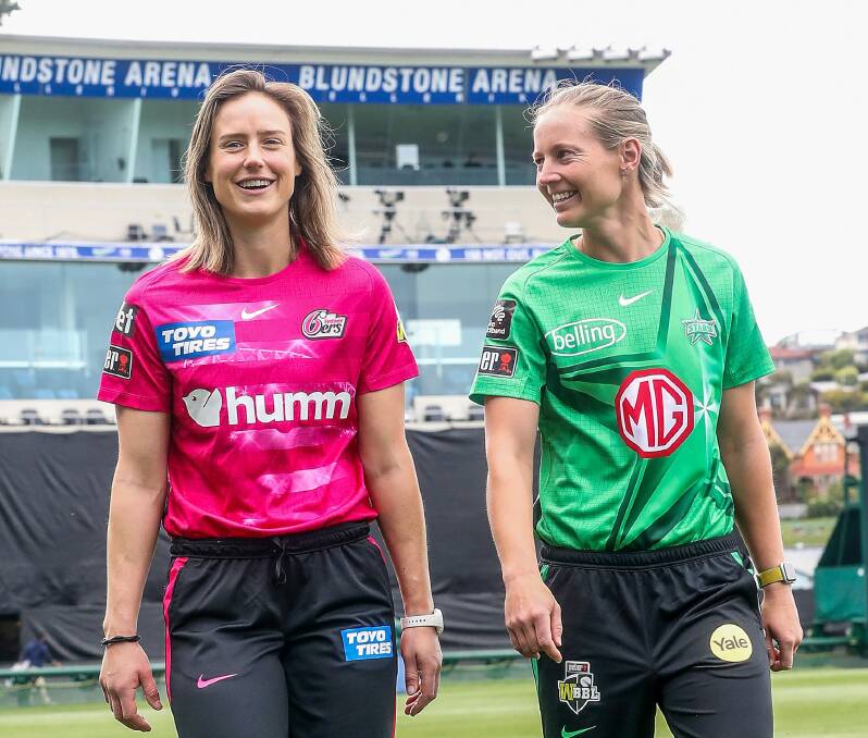 STAR STRUCK: Ellyse Perry, of the Sydney Sixers, and Meg Lanning, of Melbourne Stars, at Bellerive Oval before the WBBL opener. Picture: Sarah Reed/Getty Images