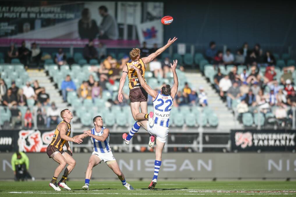 Looking up: A crowd of 9121 watched the bottom two teams in the AFL compete at UTAS Stadium on Saturday. Picture: Craig George