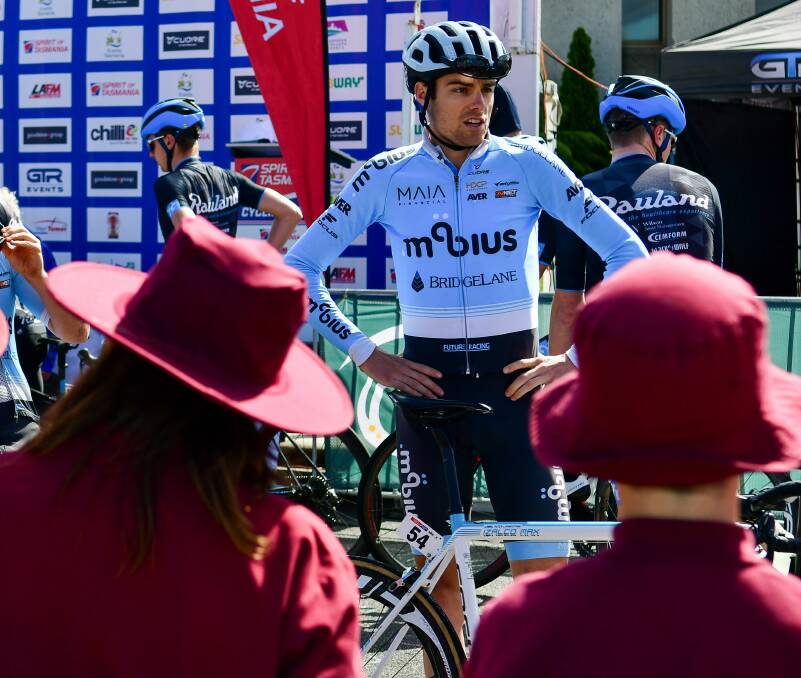 Star struck: Students from Star of the Sea School in George Town learn about cycling from NSW rider Peter Livingstone. Picture: Scott Gelston