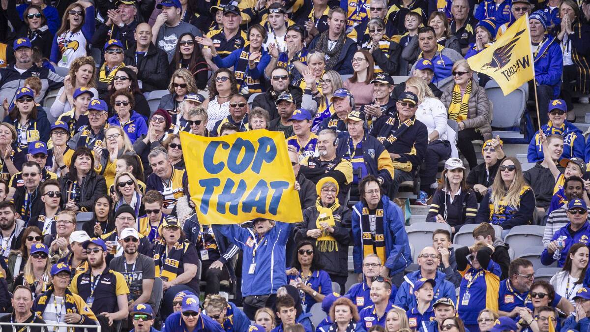 A fair cop: West Coast Eagles fans express their feelings at Optus Stadium in Perth last year. Picture: AAP 