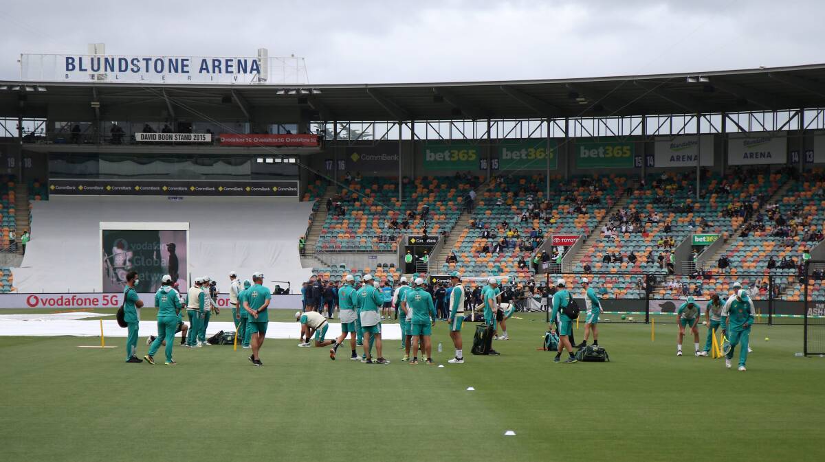 Passing the Test: Australian players warm up at Bellerive Oval ahead of Tasmania's first Ashes Test cricket match. Picture: Rick Smith