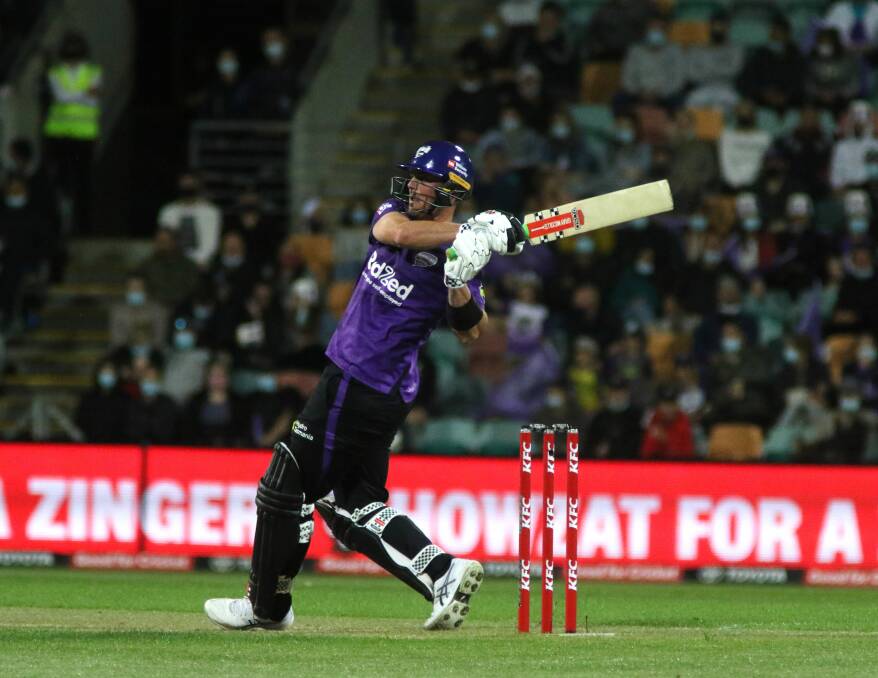 Big Ben strikes: Ben McDermott smashes a six during the Hobart Hurricanes' match with Perth Scorchers in Hobart on Tuesday. Pictures: Rick Smith