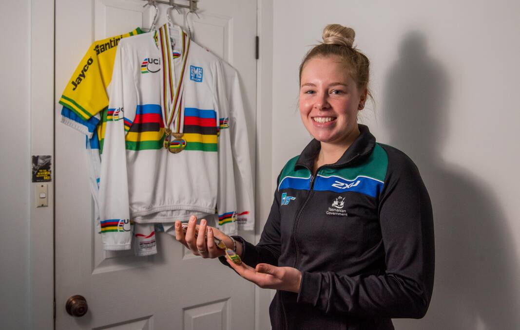 Recycled: Lauren Perry reflects on the mementos of her international cycling career in the bedroom of her Launceston home. Picture: Scott Gelston