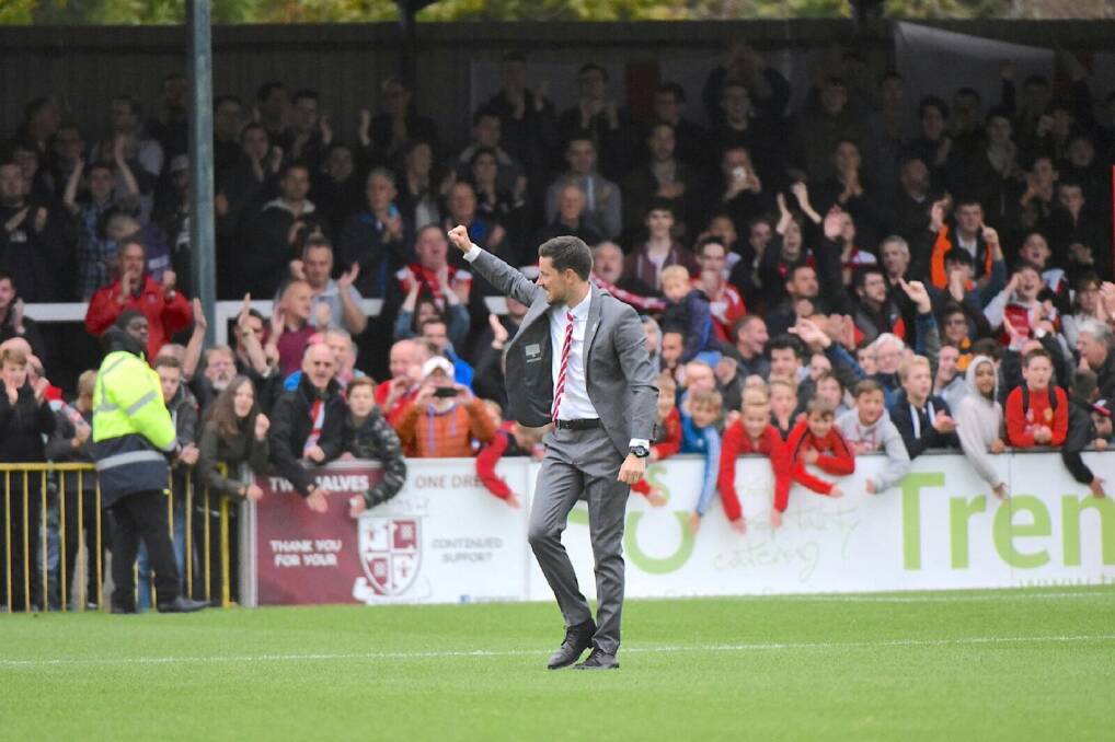 On the Cards: Anthony Limbrick celebrates with fans during his time as manager of Woking.
