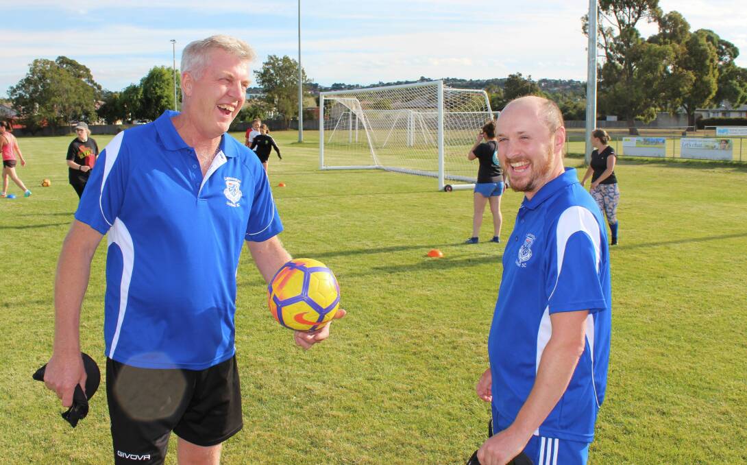 All smiles: Launceston United co-coaches Lynden Prince and Frank Compton keep the mood light at Birch Avenue training. Picture: Hamish Geale 