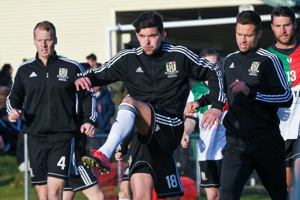 Back in black: Sam Ridgard warming up with his Launceston City teammates before their NPL Tasmania clash with Devonport. Picture: Neil Richardson