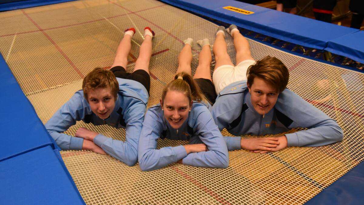 Full of bounce: PCYC trampoline gymnasts Dylan Hill, 16, Blair Kirkpatrick, 18, and Nathan Suidgeest, 19. Picture: Paul Scambler