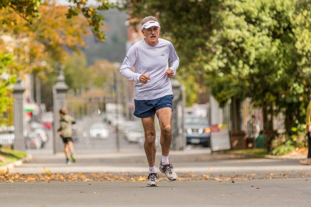 The running man: Michael Booth running through City Park. Picture: Phillip Biggs