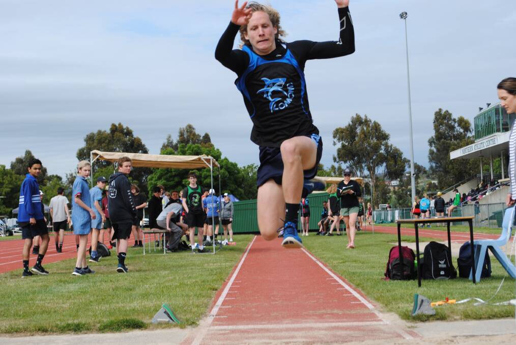 Air time: Jayden Jonson competes in the grade 10 boys' long jump at Kings Meadows High School athletics carnival.