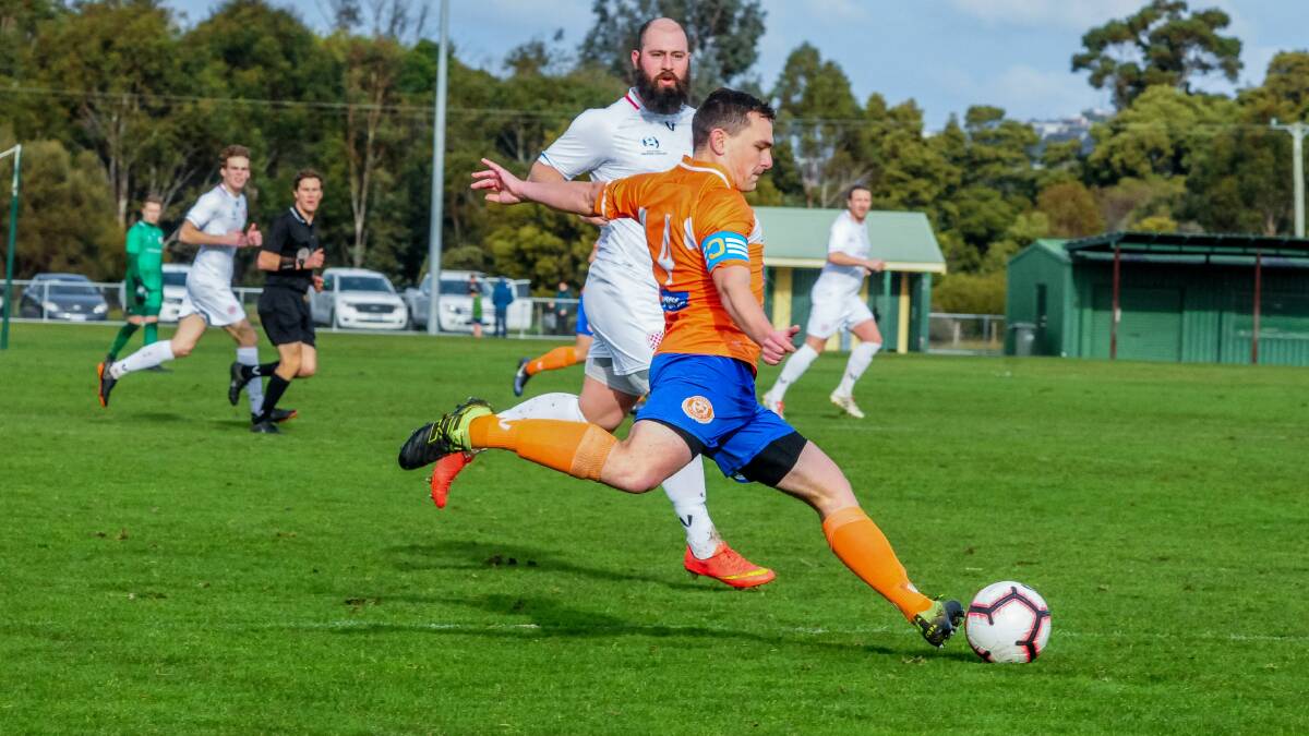 Clear view: Riverside captain Ethan Olner clears the ball away from Glenorchy goalscorer Alex Leszczynski. Picture: Neil Richardson