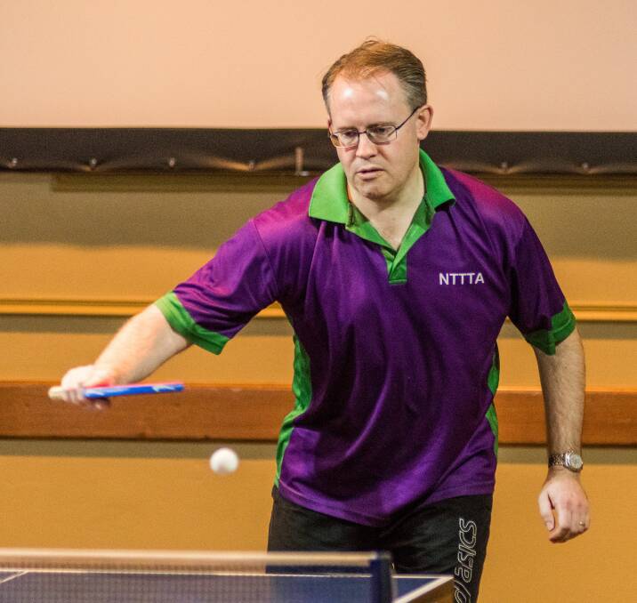 Purple reign: Mark Cunningham, of Launceston, is a picture of concentration at the state table tennis championships in Prospect. Pictures: Phillip Biggs