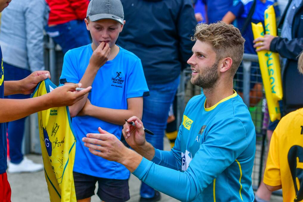 Sign post: Josh Beltz meets some of his young Tasmanian fans during the FIH Pro League fixtures in Hobart. Pictures: Scott Gelston