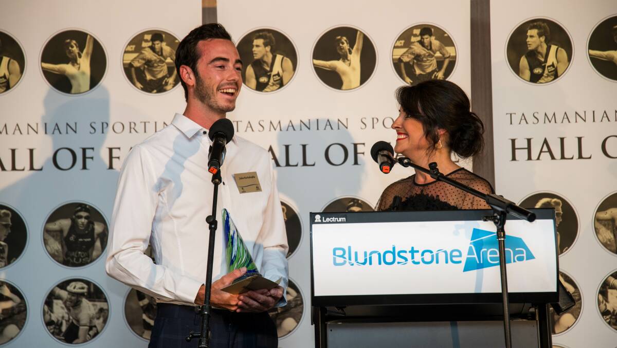 Tri again: Jake Birtwhistle and Jo Palmer share stories at the Tasmanian Athlete of the Year Award at Bellerive Oval. Pictures: Alastair Bett