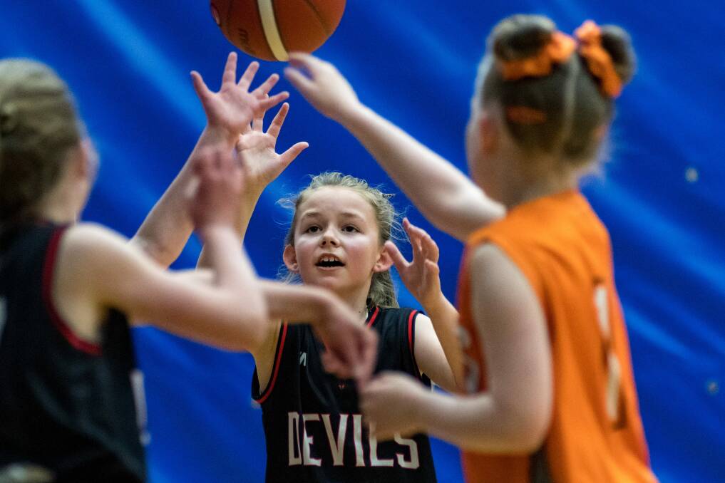 My ball: Mackenzie Towns competes for possession for her Devils team at Elphin Sports Centre at the weekend.