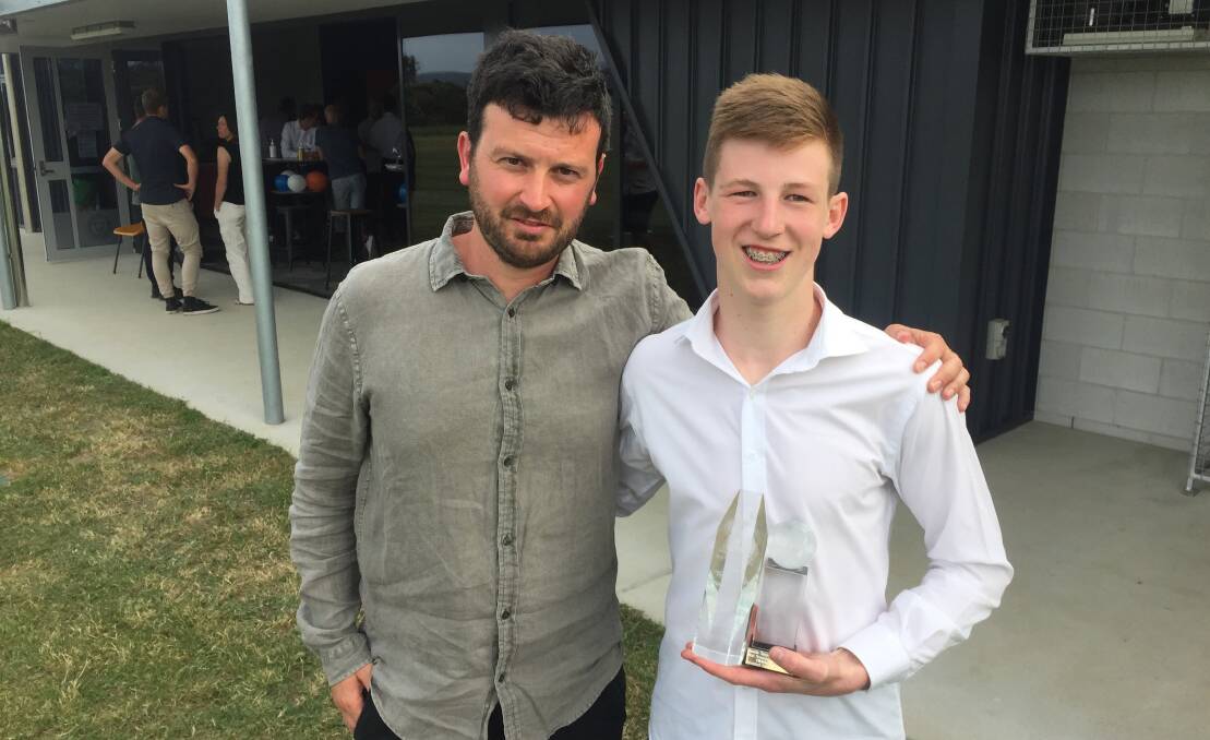 Fletcher Fulton received his player of the year award from Riverside Olympic coach Alex Gaetani. Picture: Rob Shaw