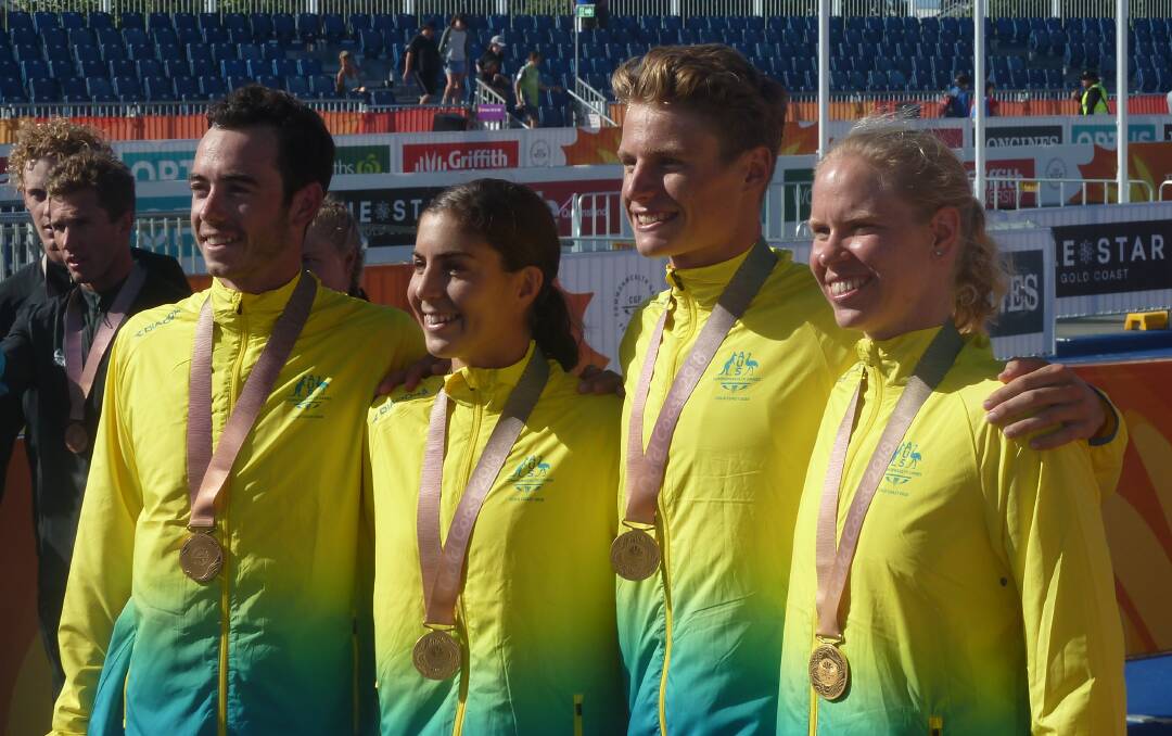 Gold coasting: Australia's Jake Birtwhistle, Ashleigh Gentle, Matt Hauser and Gillian Backhouse celebrate their mixed relay gold medal at the 2018 Commonwealth Games. Picture: Rob Shaw