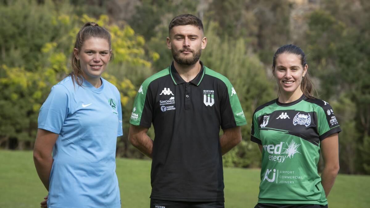 Flying colours: Jess Robinson promoting the Festival of Football with Western United's Ivan Vujica and Calder's Julia Sardo. Picture: Craig George. T
