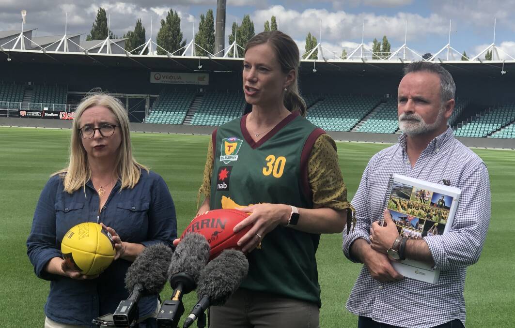 Short memories: Labor's Michelle O'Byrne, Rebecca White and David O'Byrne question the North Melbourne deal they helped introduce in 2011. Picture: Rob Inglis
