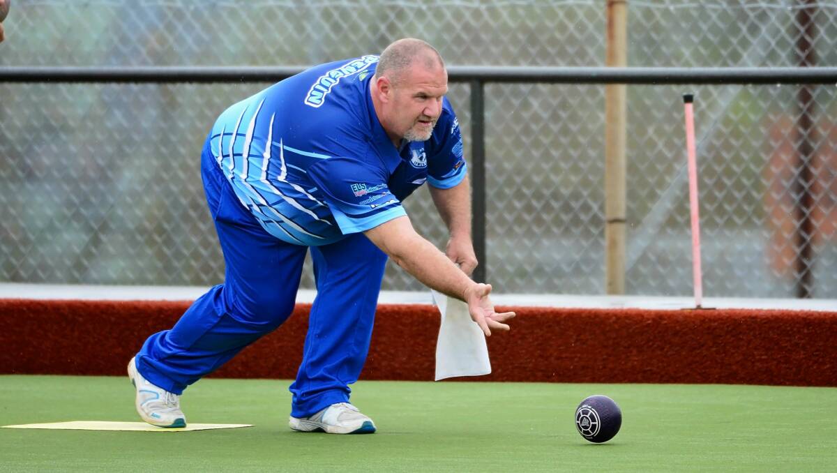 Blue day: Penguin bowler Chris Dudman gets his eye in, showing off the form that won him the prestigious title against a quality field.