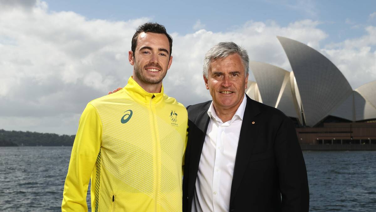 Jake Birtwhistle receives his Olympic uniform from Chef de Mission and fellow West Tamar resident Ian Chesterman in Sydney on Wednesday. Picture: AOC