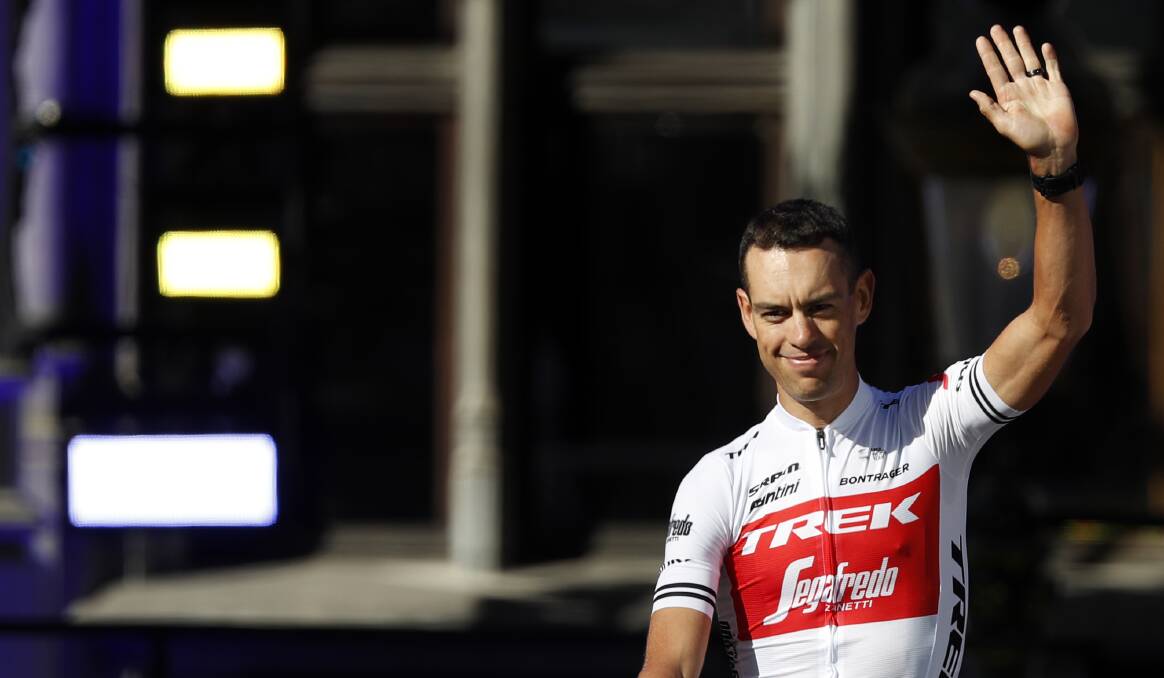 Wave of emotion: Richie Porte waves to fans during the Tour de France teams presentation at the Grand Place in Brussels. Picture: AP