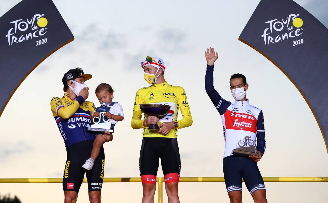 MASKED AVENGERS: Tour de France top three Primoz Roglic, Tadej Pogacar and Richie Porte on the podium in Paris. Picture: Getty Images