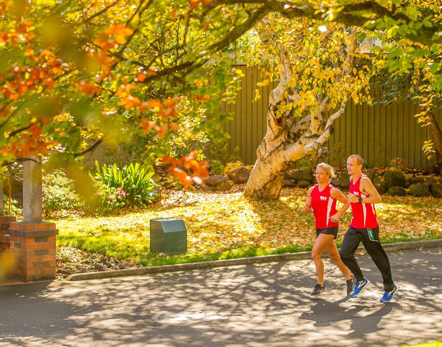 Turning a new leaf: Josh Harris training with fellow Launceston 10 ambassador Kate Pedley in City Park earlier this year. Picture: Scott Gelston. 