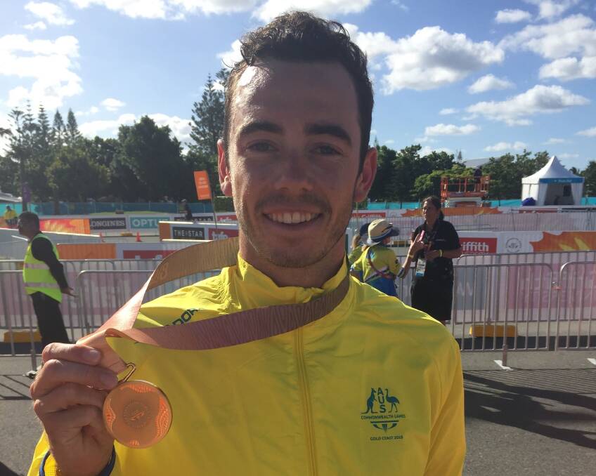 Striking gold: Jake Birtwhistle with his Commonwealth Games gold medal. Picture: TIS