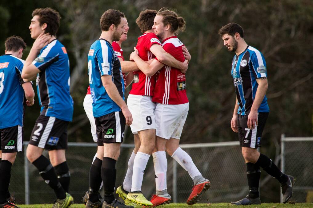 Launceston City players congratulate each other after the first goal against Kingborough Lions scored by Tom Ottavi. Picture: Solstice Digital