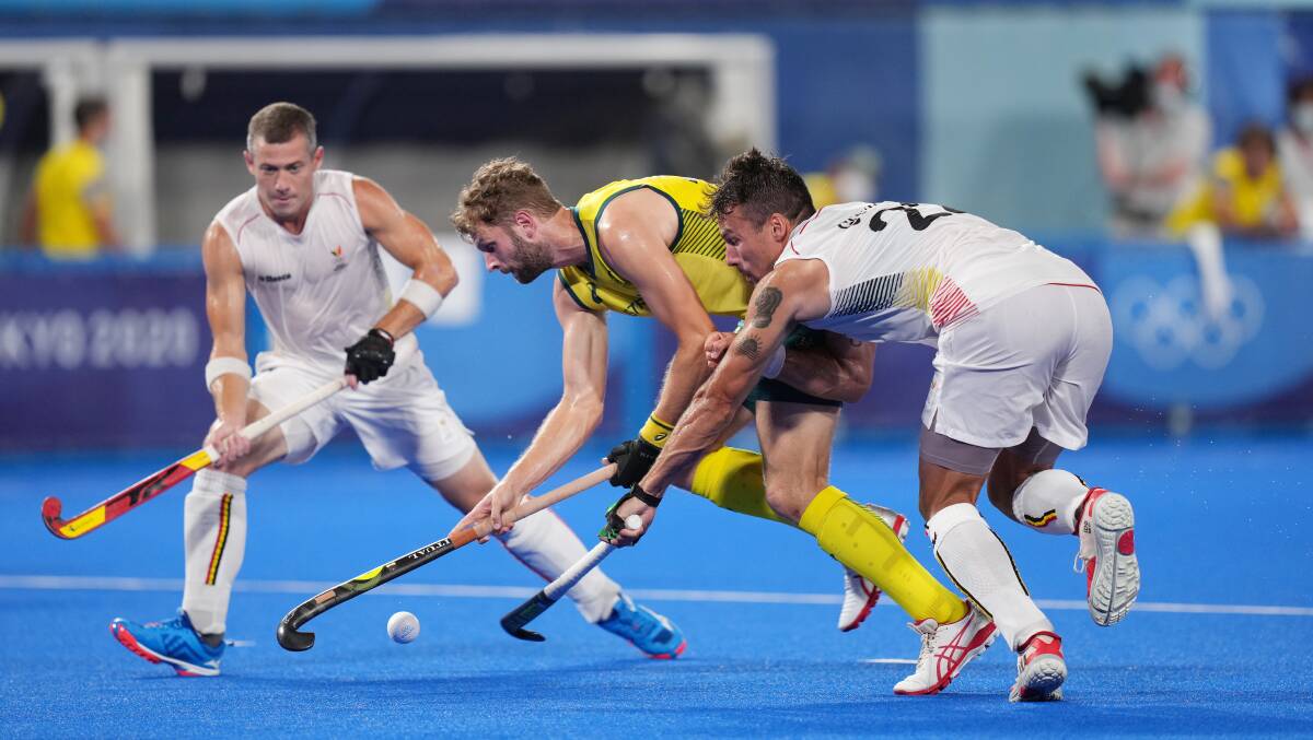 Josh Beltz takes on the Belgian defence in the Olympic hockey final.