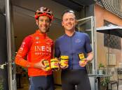 Spread eagles: Richie Porte welcomes a shipment of Vegemite ahead of the Giro d'Italia with fellow Australian Simon Gerrans. Picture: Instagram