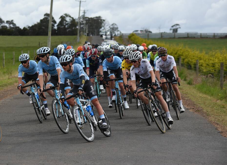 Looking up: The peloton takes the corner at Armstrongs Lane after leaving Longford.