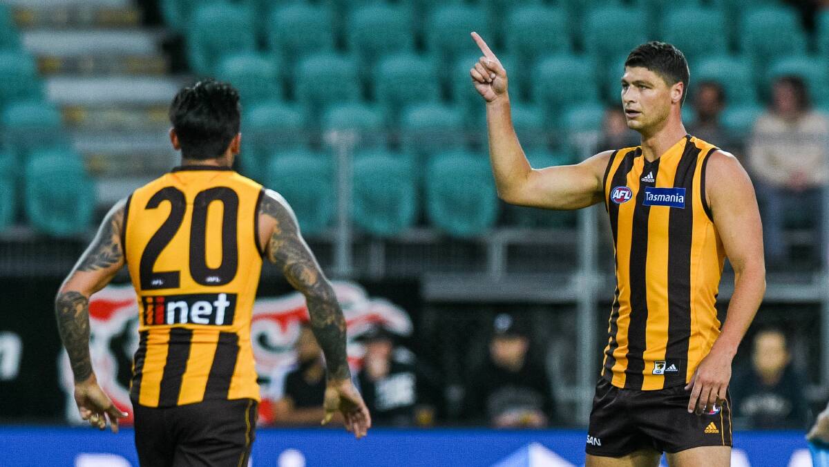 Hawk talk: Jonathon Patton points the way back to Victoria after kicking Hawthorn's first goal in the practice match against Melbourne at UTAS Stadium in Launceston in March. Picture: Phillip Biggs