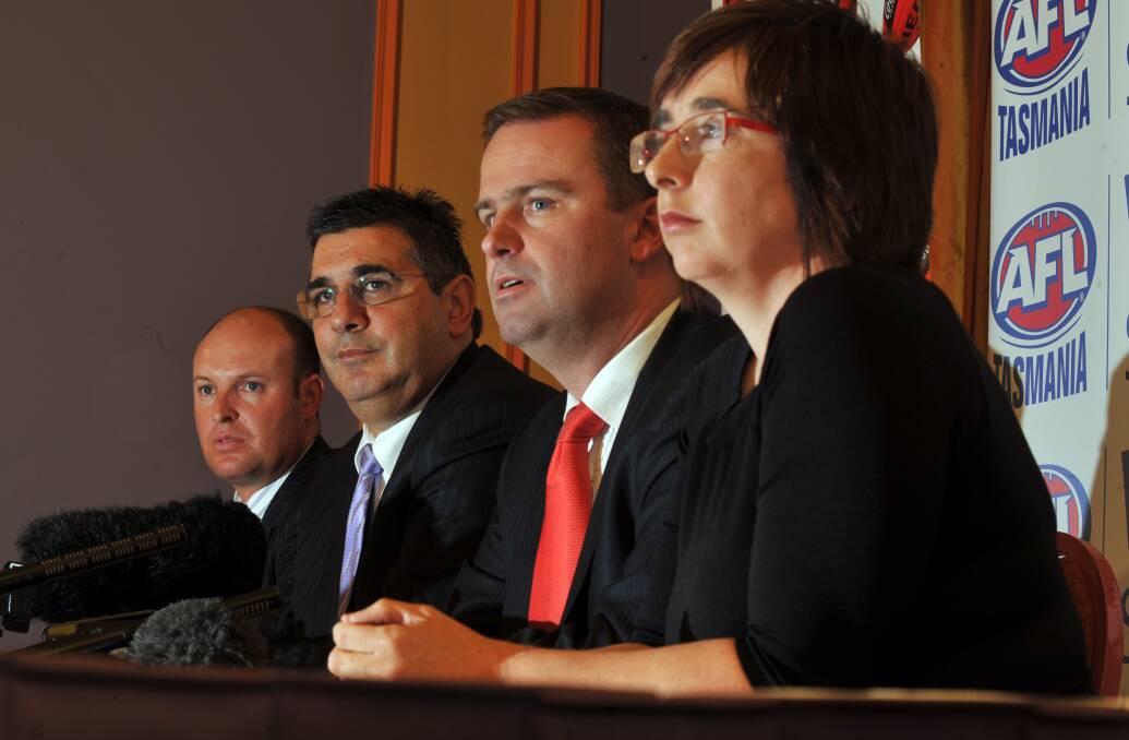 Dominic Baker in his days as AFL Tasmania chairman with league boss Andrew Demetriou, Tasmanian Premier David Bartlett and Sport Minister Michelle O'Byrne in 2009. Picture: Will Swan