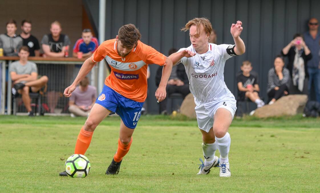 Learning experience: Riverside's Aaron Campbell takes on Glenorchy's Samuel James when the sides met in March. Picture: Paul Scambler.