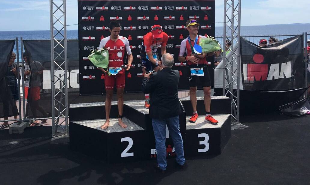 Iron steel: Tasmanian Cam Wurf (right) enjoys his third place at Ironman France. Picture: Twitter