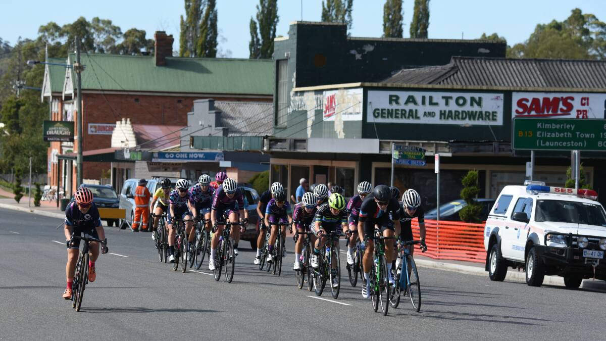 Road workers: Cyclists make their way up the main street of Railton in the Oceania Road Championship road races. Picture: Paul Scambler