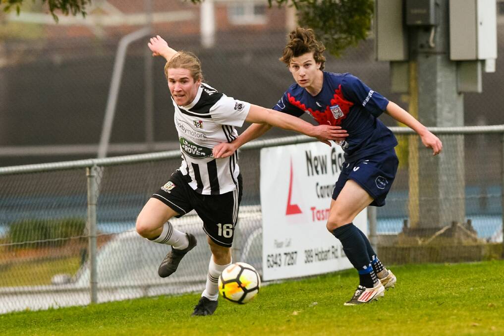 Looking up: Launceston City's Isaac Degetto makes his way past Zebras' Henry Fagg at Prospect Park. Picture: Phillip Biggs 