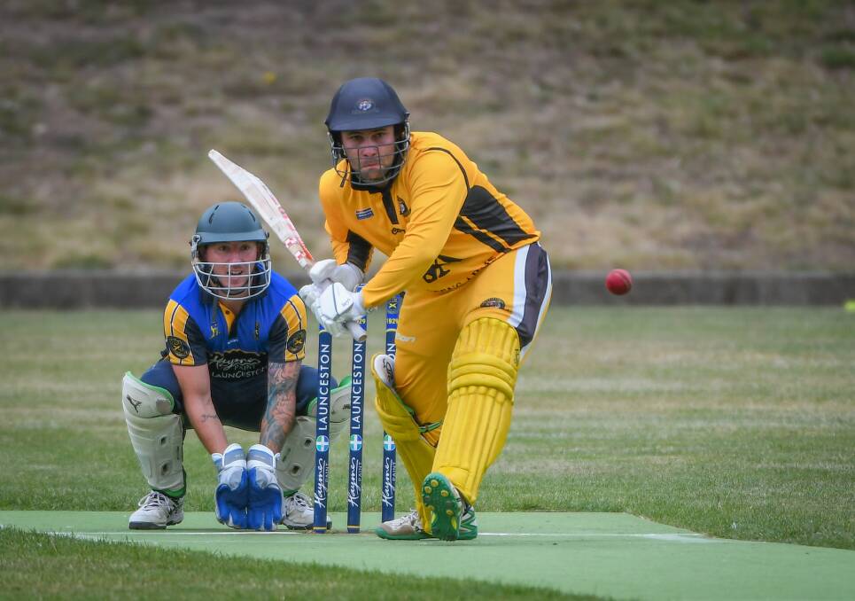 ATTACKING: Trevallyn wicket-keeper Nathan Barry looks on as Longford's Mitch Fawkner advances. Picture: Paul Scambler