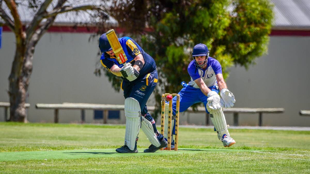 TON UP: Trevallyn's Drew Clark watched by ACL wicket-keeper Simon Chappell at Uni Oval. Picture: Paul Scambler