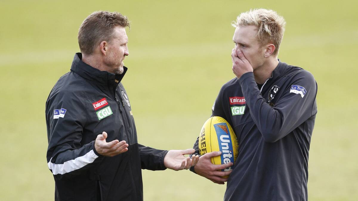 Support: Collingwood coach Nathan Buckley discusses the matter with Stephenson. Picture: AAP
