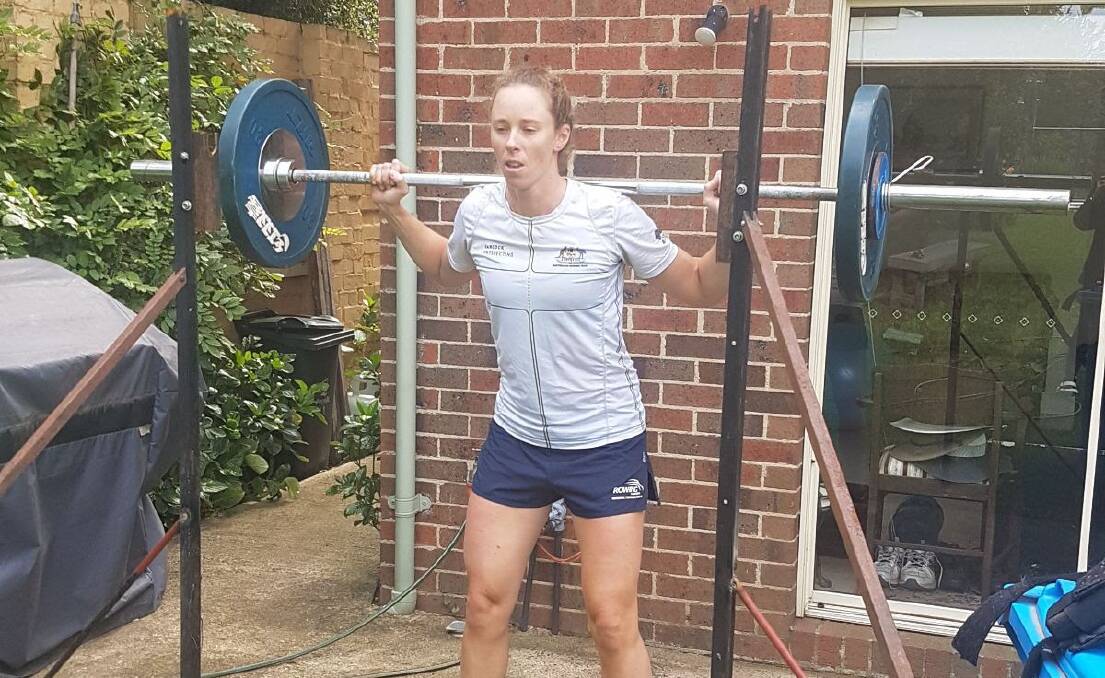 Weighting in line: Sarah Hawe in her specially-built home training set-up. Picture: TIS