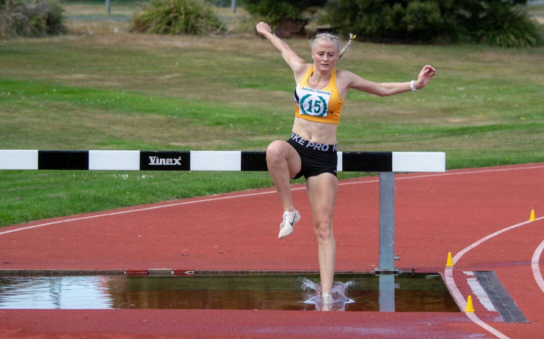LEAP OF FAITH: Abbie Butler, of Newstead Athletics, in the under-18 women's 2000-metres steeplechase.